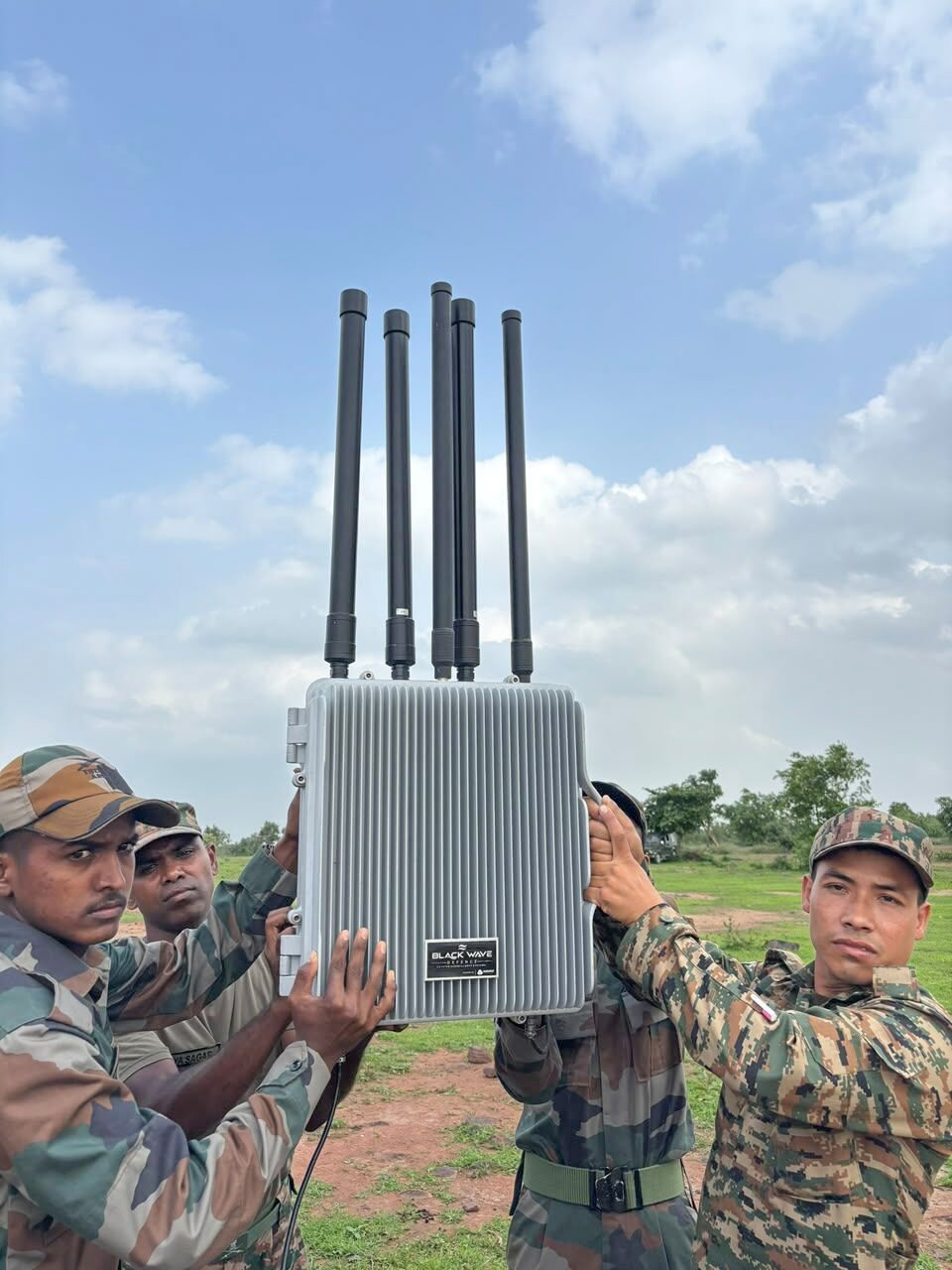 Indian Army soldiers assembling a Black Wave Defence multi-antenna anti-drone jamming system in the field